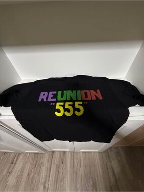 Black Short-Sleeve Graphic Tee with Multicolor REUNION "555" Print